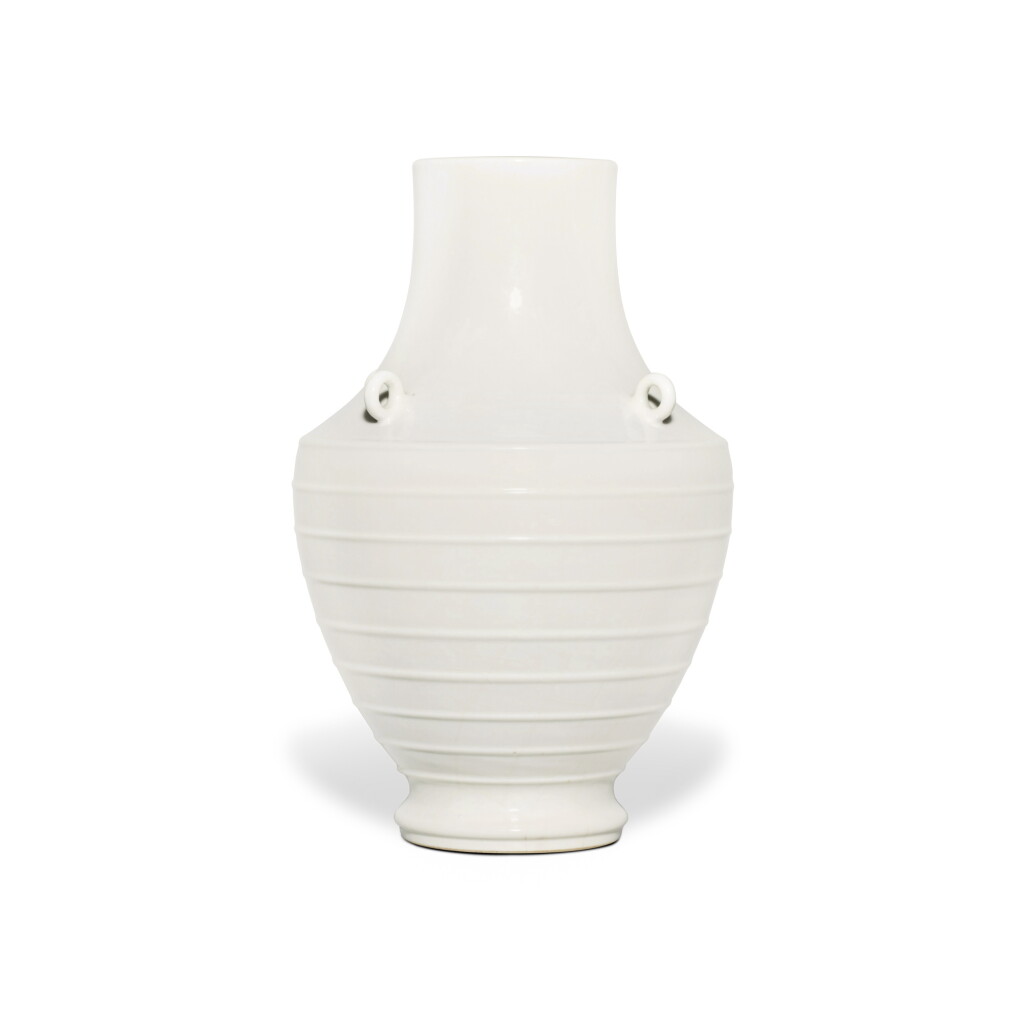 View full screen - View 1 of Lot 6. A fine and extremely rare archaistic white-glazed soft-paste vase, Seal mark and period of Qianlong | 清乾隆 白釉弦紋四繫尊 《大清乾隆年製》款.