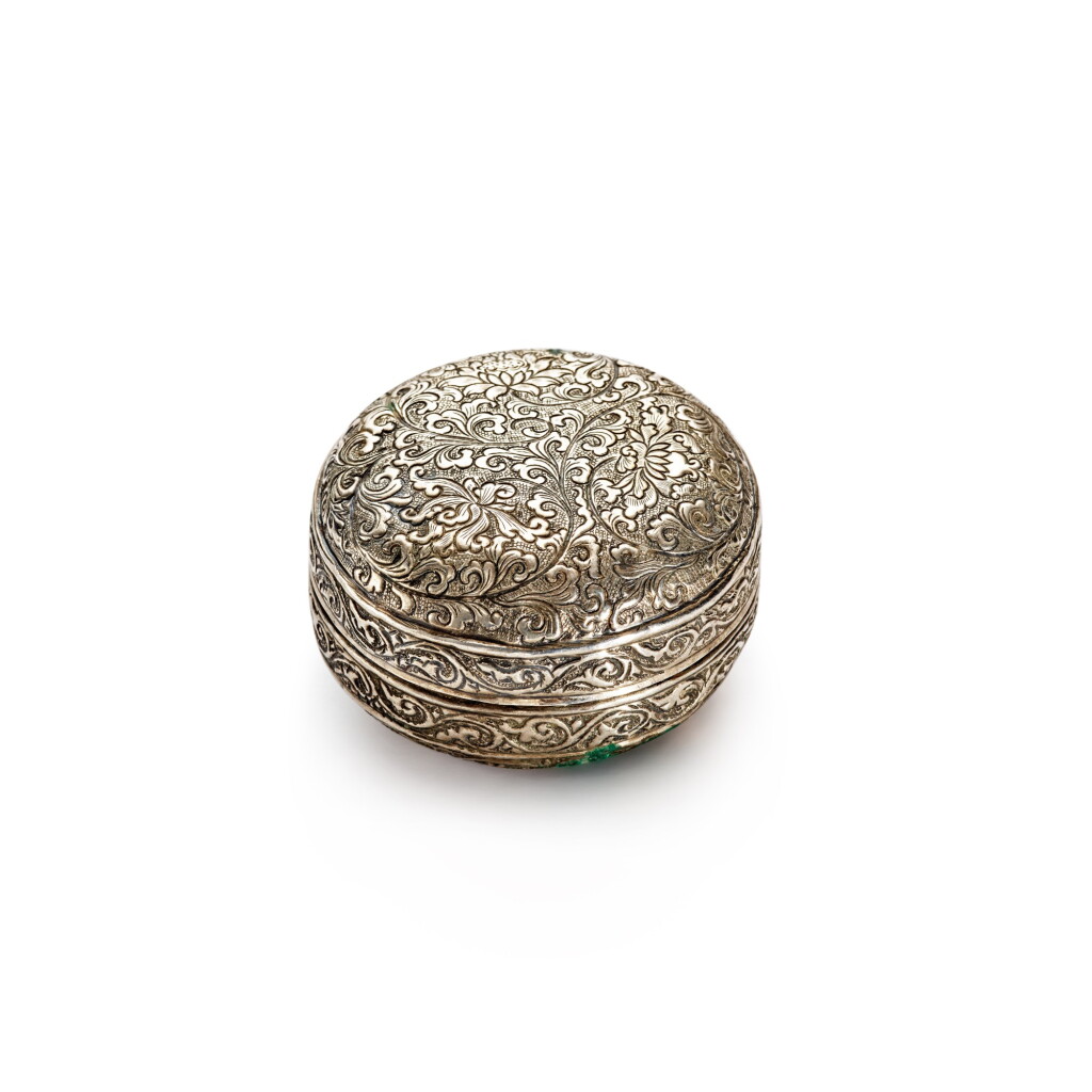 View full screen - View 1 of Lot 40. A repoussé silver 'lotus' box and cover, Five Dynasties / Northern Song dynasty | 五代 / 北宋 銀鏨纏枝花卉紋蓋盒.