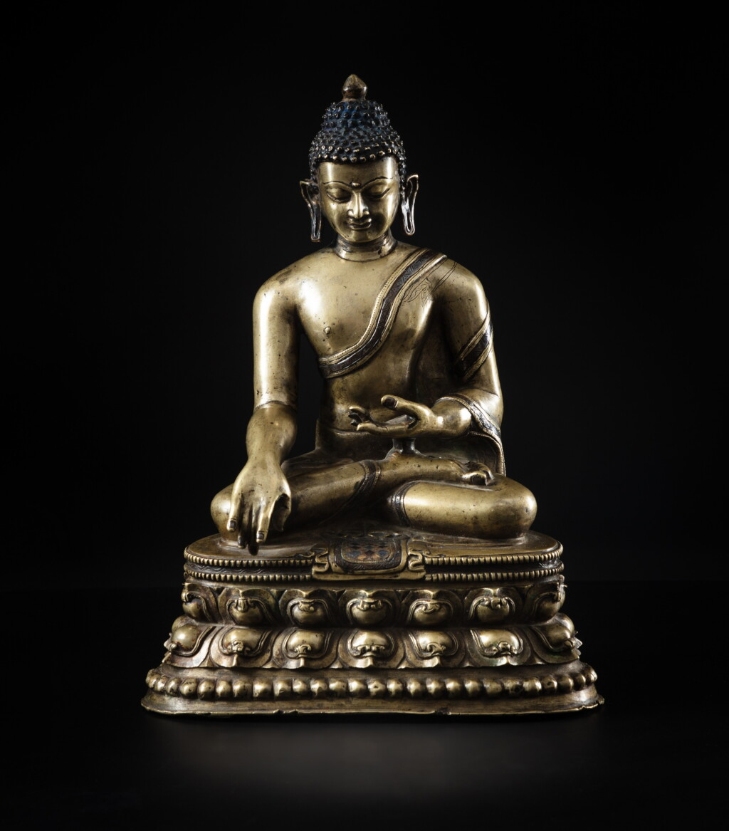 View full screen - View 1 of Lot 207. A silver and copper-inlaid copper alloy figure of Shakyamuni Buddha, Tibet, 12th - 13th century | 十二至十三世紀 藏傳銅錯銀釋迦牟尼佛坐像.