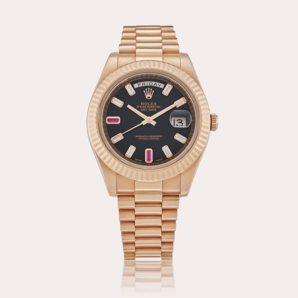 View full screen - View 1 of Lot 60. Reference 218235 Day-Date II | A pink gold, ruby and diamond-set automatic wristwatch with day, date and bracelet, Circa 2015.