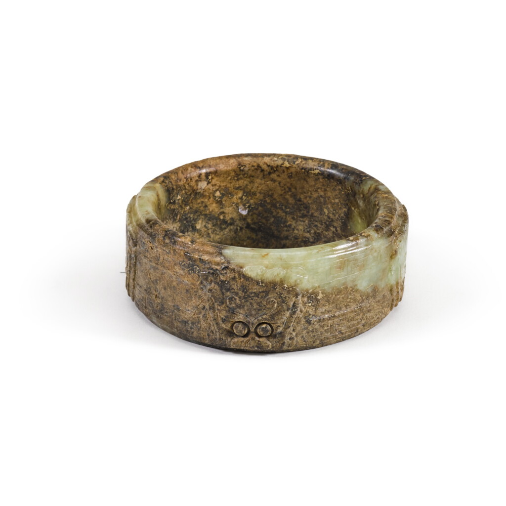 View full screen - View 1 of Lot 84. An archaistic brown and celadon jade 'taotie' ring, Song - Ming dynasty .