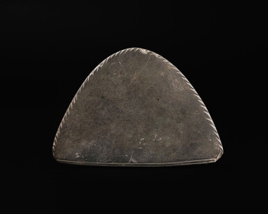 View full screen - View 1 of Lot 140. An Egyptian Greywacke Cosmetic Palette, late Predynastic Period/1st Dynasty, circa 3200-2900 B.C..