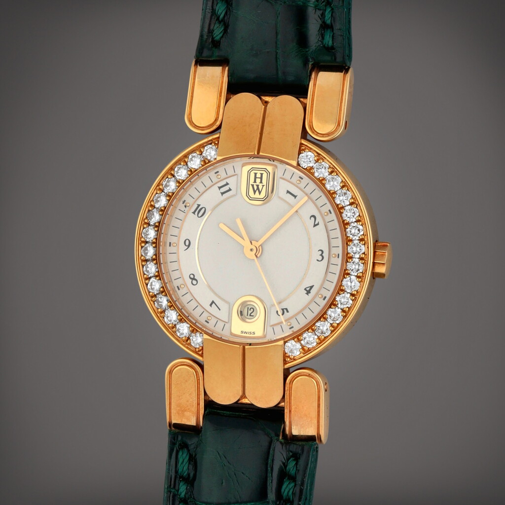 View full screen - View 1 of Lot 385. Reference LQ27GLD/2 | A pink gold and diamond-set wristwatch with date | Circa 2005.