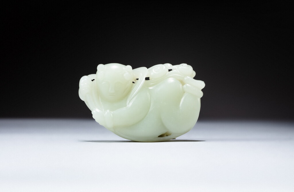 View full screen - View 1 of Lot 185. A pale celadon jade 'boy and lotus' pebble, 19th - 20th century | 十九至二十世紀 青白玉持蓮童子.