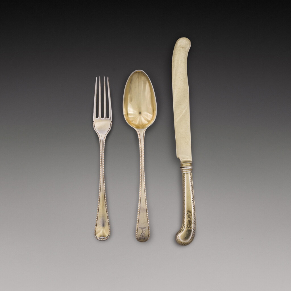 View full screen - View 1 of Lot 379. A George III silver-gilt flatware set, Thomas Chawner, London, 1773.