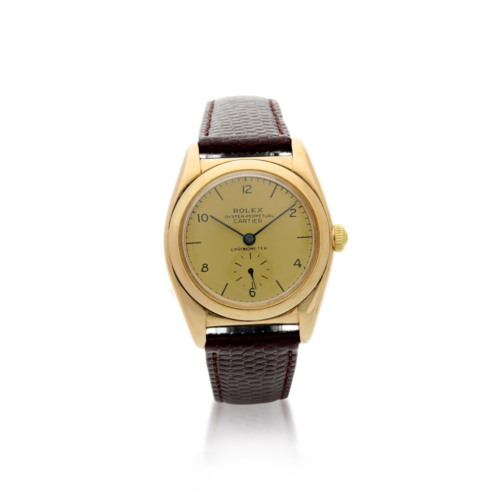 View full screen - View 1 of Lot 168. ROLEX | REFERENCE 3130 OYSTER PERPETUAL 'BUBBLEBACK' RETAILED BY CARTIER: A YELLOW GOLD AUTOMATIC WRISTWATCH, CIRCA 1940.
