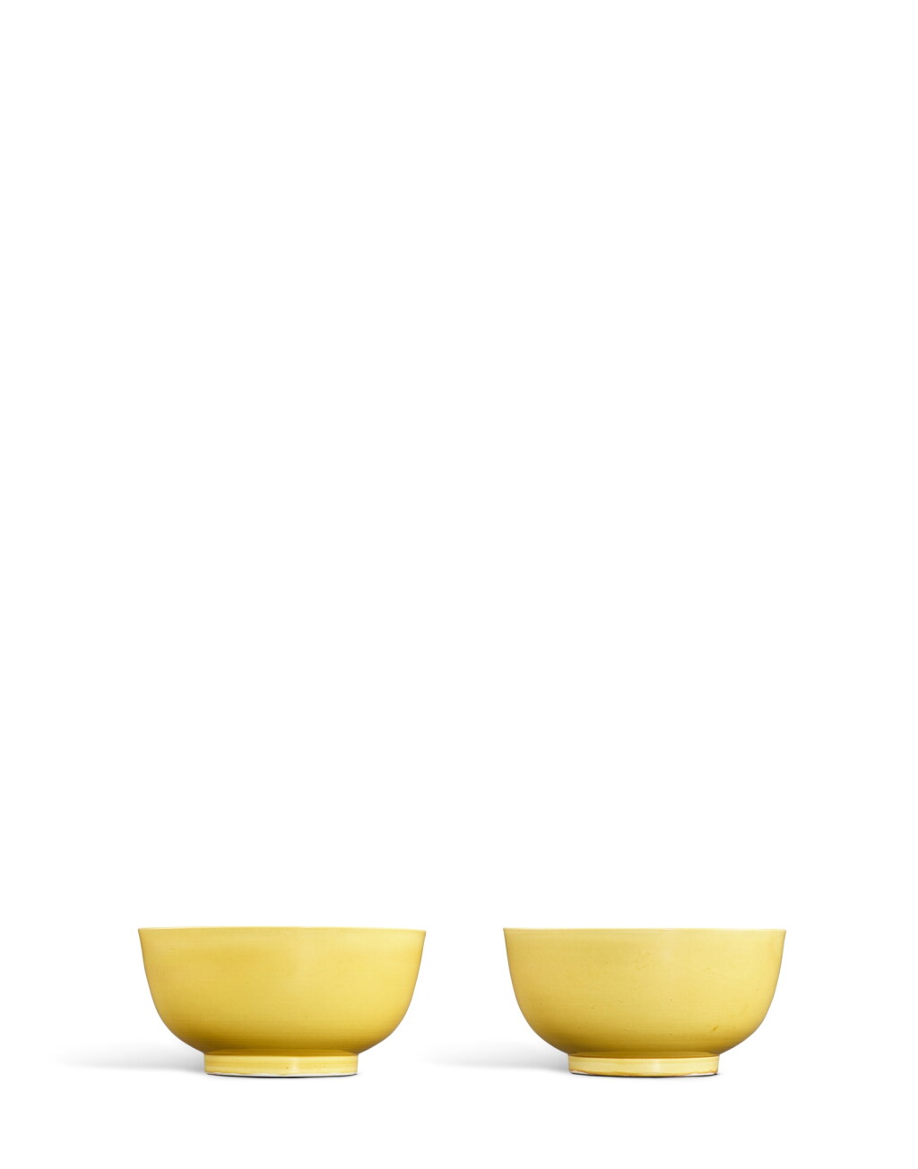 View full screen - View 1 of Lot 25. A pair of yellow-glazed bowls, Marks and period of Kangxi.