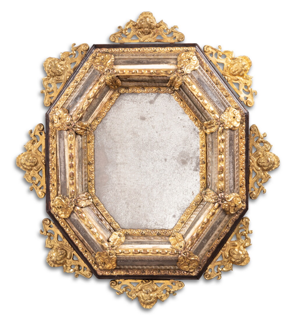 View full screen - View 1 of Lot 21. A brass mounted, glass and ebonised wood mirror, Italian, late 17th century Miroir à parecloses, en bois noirci, verre filé et laiton, Italien, fin du XVIIeme siècle.