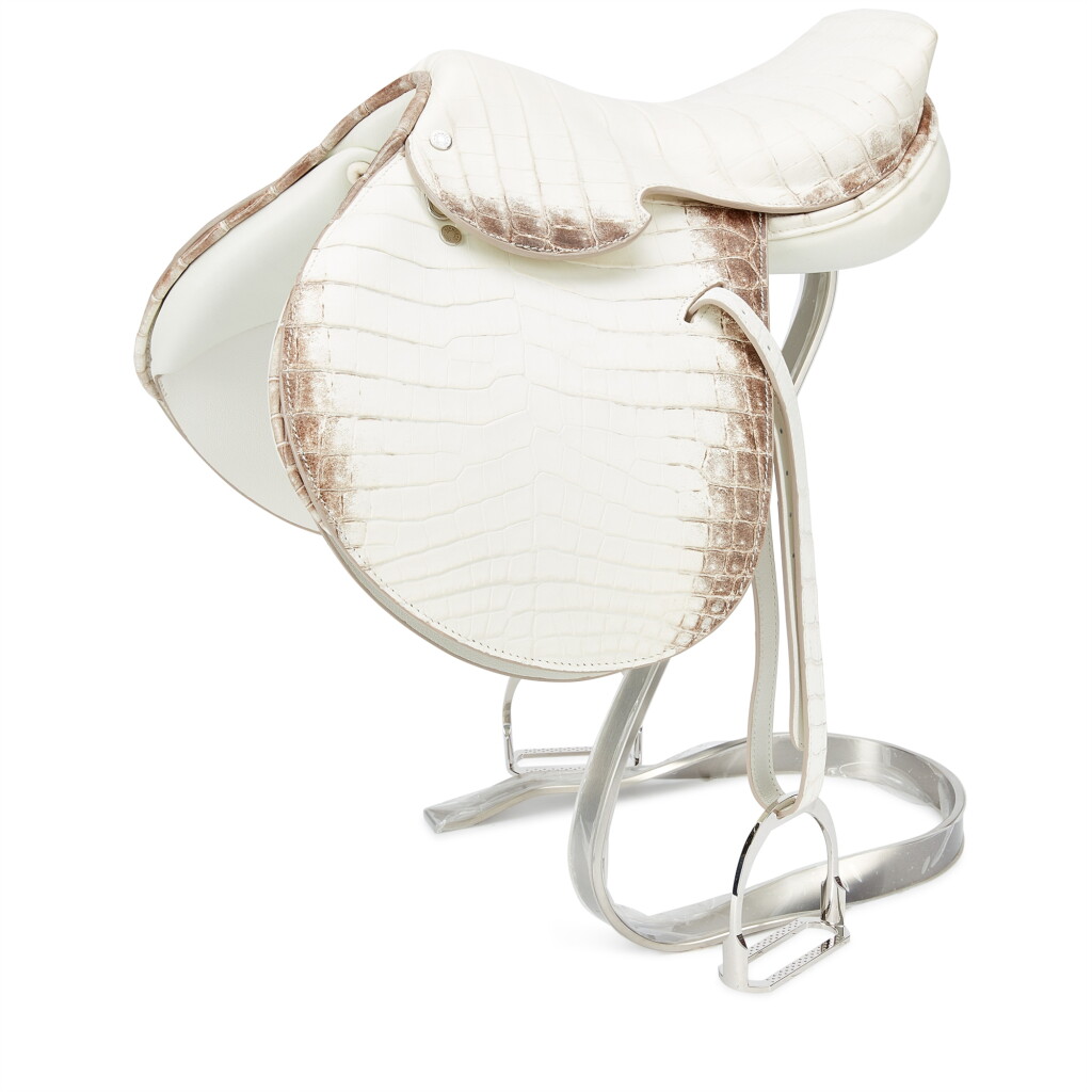 View full screen - View 1 of Lot 1102. White Matte Niloticus Crocodile and Silver Metal Himalaya Mini Saddle Statue .