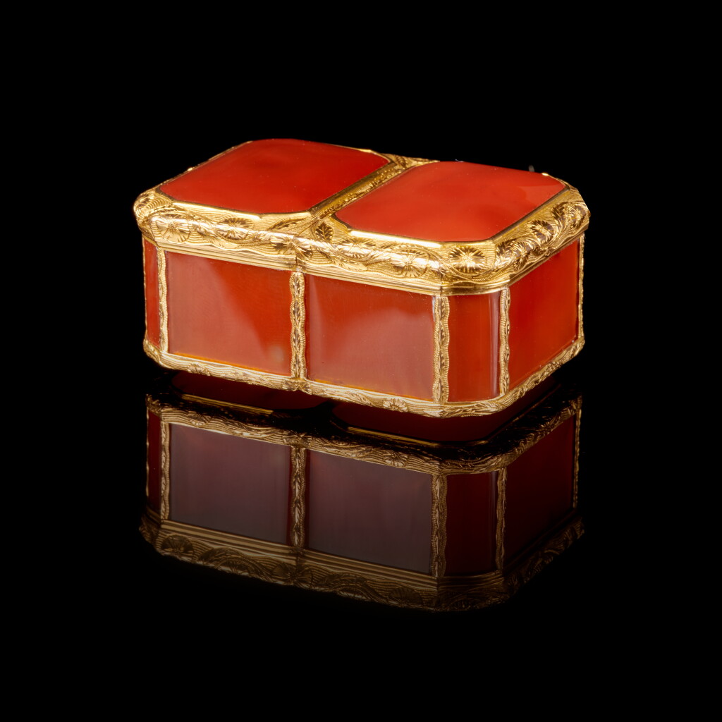 View full screen - View 1 of Lot 1063. A double-opening carnelian snuff box with cagework mounts, Noel Hardivilliers, Paris, 1738.