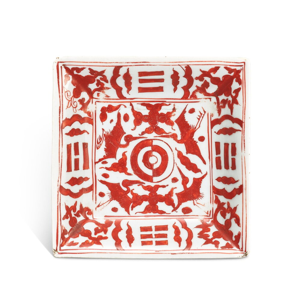 View full screen - View 1 of Lot 427. An iron-red 'crane and trigram' square dish, Mark and period of Jiajing 明嘉靖 礬紅彩八卦壽鶴紋方盤 《大明嘉靖年製》款.