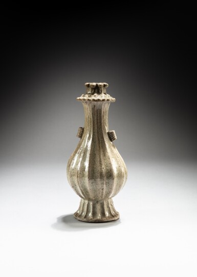 View full screen - View 1 of Lot 115. A qingbai-type fluted bottle vase, Yuan dynasty, probably Zhejiang kilns | 元 或浙江省 青白釉瓜棱式長頸瓶.