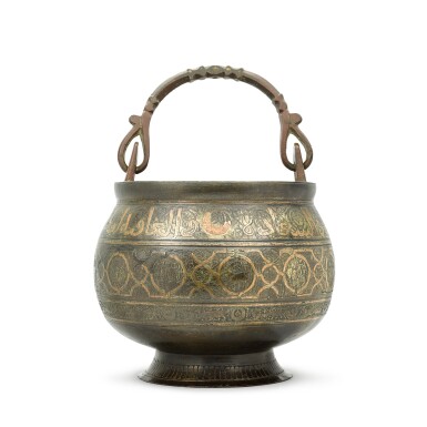 View full screen - View 1 of Lot 94. A Khurasan copper-inlaid cast bronze bucket with the zodiac signs, Persia, 13th century.