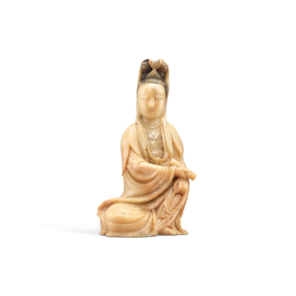 View full screen - View 1 of Lot 560. A soapstone seated figure of Guanyin, Qing dynasty, 18th century 清十八世紀 壽山石雕觀音坐像.
