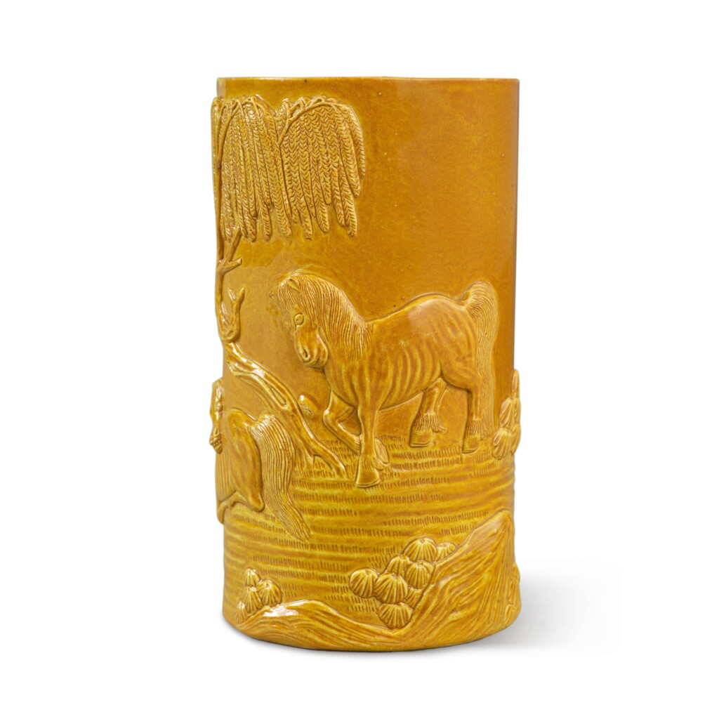 View full screen - View 1 of Lot 81. A carved yellow-glazed biscuit 'horse' brushpot, Seal mark and period of Daoguang.