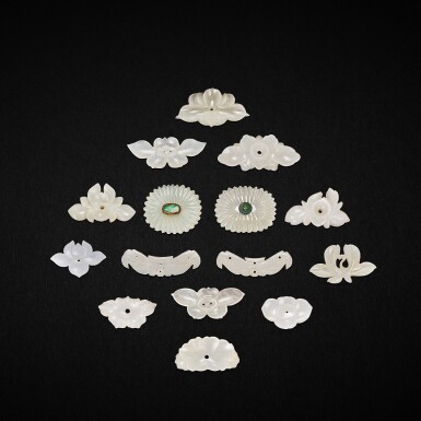 View full screen - View 1 of Lot 3055. A group of thirty three white and pale celadon jade flower ornaments, Yuan - Ming dynasty 元至明 白玉及青玉雕花形飾件一組三十三件.