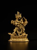 A gilt copper alloy figure of Chakrasamvara and Vajravarahi, Nepal, 16th century | 尼泊爾 十六世紀 銅合金鎏金勝樂金剛與金剛亥母雙修像 