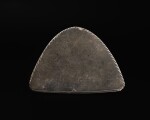 An Egyptian Greywacke Cosmetic Palette, late Predynastic Period/1st Dynasty, circa 3200-2900 B.C.