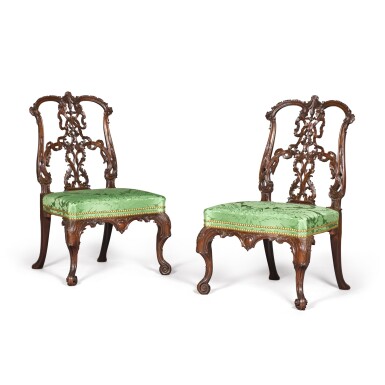 View full screen - View 1 of Lot 1053. A Pair of George II Carved Mahogany Ribbon-Back Side Chairs, Circa 1755, After a Design by Thomas Chippendale.