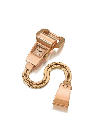 View full screen - View 1 of Lot 125. PATEK PHILIPPE | A PINK AND YELLOW GOLD LOCK BRACELET WATCH WITH CONTRACT CASE CIRCA 1950.