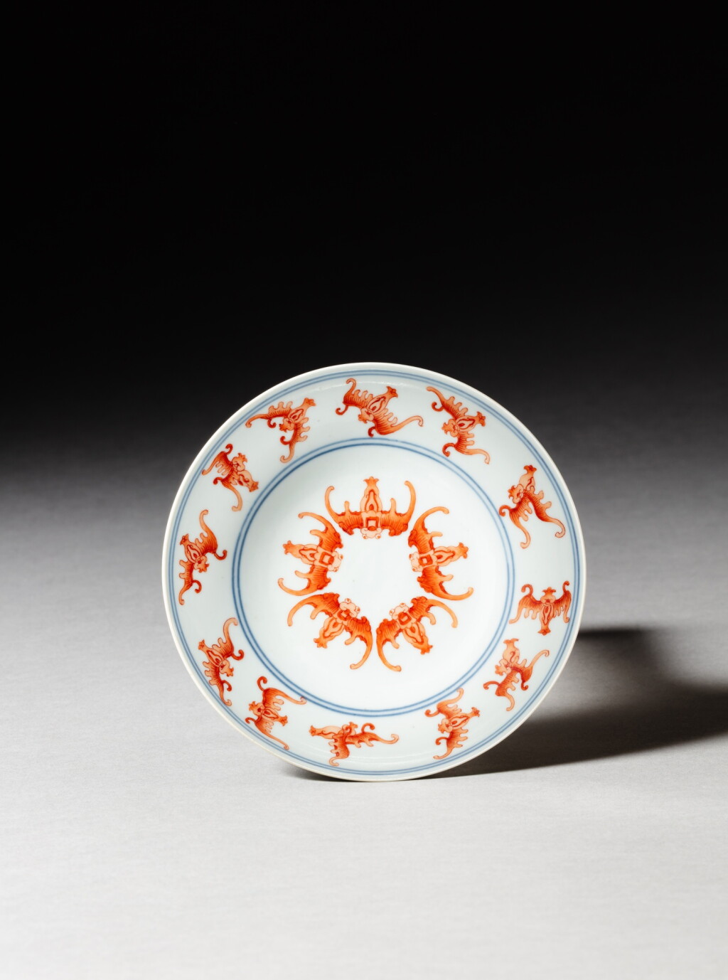 View full screen - View 1 of Lot 192. An iron-red and underglaze-blue 'bats' dish, Seal mark and period of Daoguang | 清道光 青花礬紅彩五福盤《大清道光年製》款.