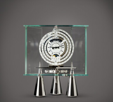 View full screen - View 1 of Lot 718. Atmos du Millénaire Atlantis Horloge atmosphérique en acier et verre avec quantième perpétuelle 1000 ans et phases de lune | Stainless steel and glass atmos clock with 1000 year perpetual calendar and moon phases Vers 2000 | Circa 2000.