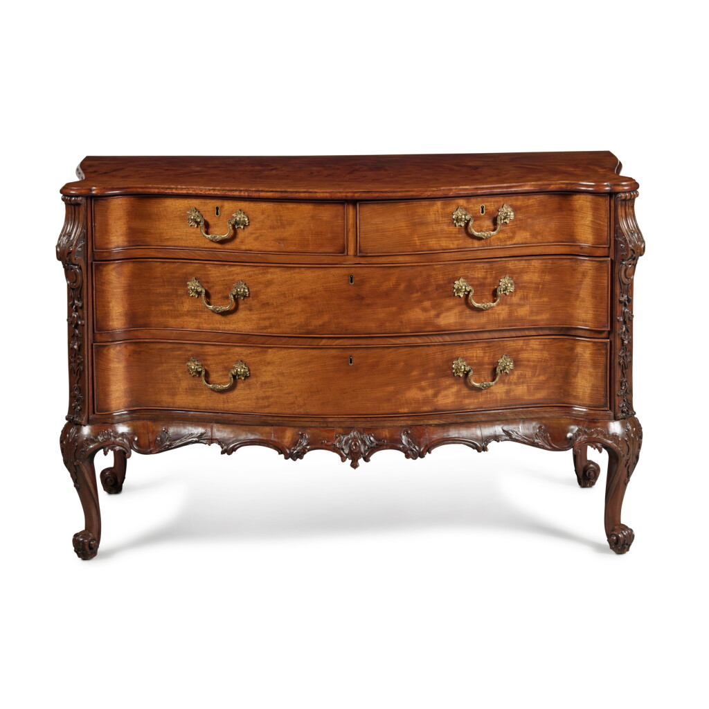 View full screen - View 1 of Lot 30. A George II Carved Mahogany Serpentine Commode, circa 1760.