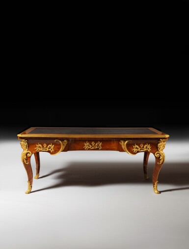 View full screen - View 1 of Lot 55. A Louis XV gilt-bronze mounted kingwood parquetry bureau plat “à têtes de femmes", circa 1732-1736, attributed to Noël Gérard.