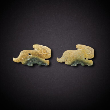 View full screen - View 1 of Lot 3493. A pair of celadon jade 'hare' pendants, Shang dynasty | 商 青玉兔形珮一對.