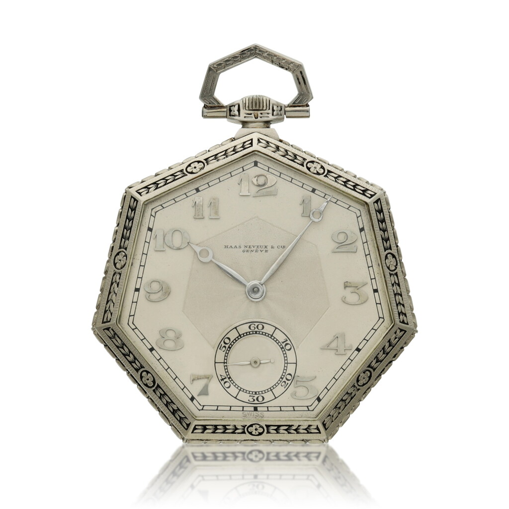 View full screen - View 1 of Lot 115. A white gold heptagonal open faced watch, Circa 1910.