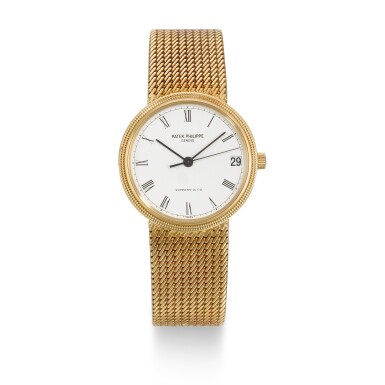 View full screen - View 1 of Lot 339. PATEK PHILIPPE | CALATRAVA DOUBLE-SIGNED "TIFFANY & CO", REF 3802/205J, YELLOW GOLD BRACELET WATCH WITH DATE AND RETAILER SIGNATURE, CIRCA 2000.