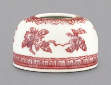 View full screen - View 1 of Lot 3. A FINE AND RARE SMALL COPPER-RED 'SANDUO' WATERPOT, QIANLONG SEAL MARK AND PERIOD | 清乾隆 釉裏紅折枝三多紋水盂 《大清乾隆年製》款.