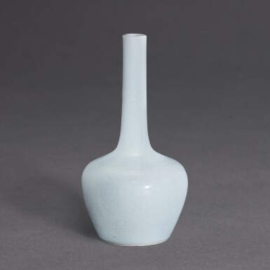 View full screen - View 1 of Lot 3513. A fine and rare small white-glazed incised-decorated 'dragon' bottle vase, Mark and period of Yongzheng | 清雍正 白釉劃花龍紋長頸小瓶 《大清雍正年製》款.