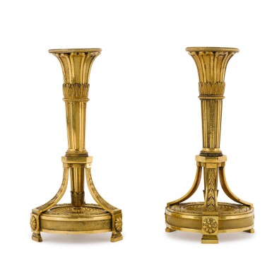 View full screen - View 1 of Lot 189. A pair of Louis XVI gilt-bronze candlesticks, the design attributed to Jean-Louis Prieur, late 18th century.