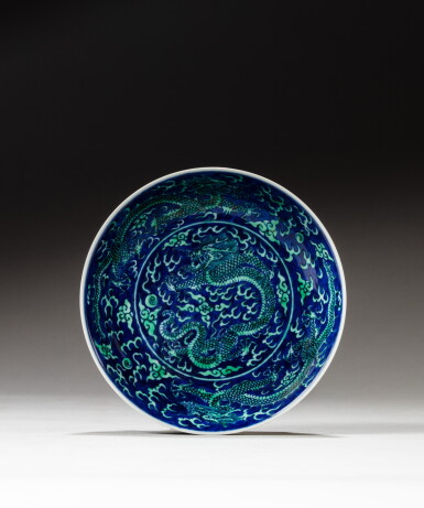 View full screen - View 1 of Lot 165. A blue-ground green-enameled 'dragon' dish,Mark and period of Guangxu | 清光緒 青花地綠彩趕珠雲龍紋盤 《大清光緒年製》款.
