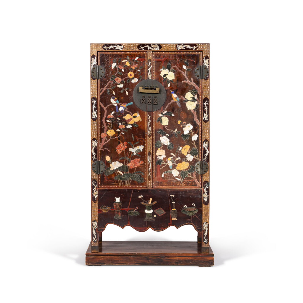View full screen - View 1 of Lot 161. A hard-stones inlaid lacquered wood 'flower and bird' cabinet Qing dynasty, 18th-19th century | 清十八至十九世紀 漆木百寶嵌花鳥圖方角櫃.
