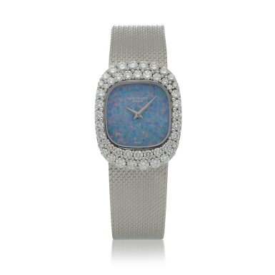 View full screen - View 1 of Lot 78. Ref. 4392/1 White gold and diamond-set bracelet watch with opal dial Circa 1980.