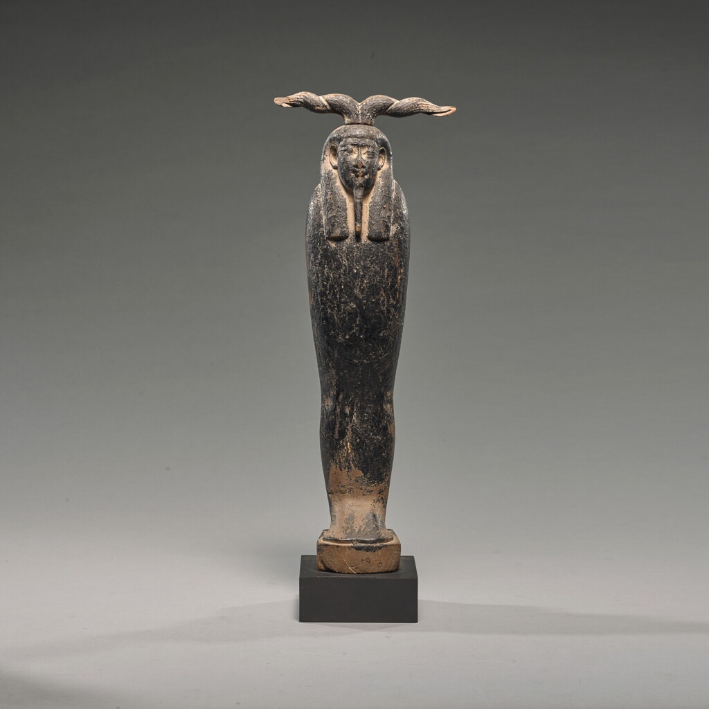 View full screen - View 1 of Lot 70. AN EGYPTIAN BITUMEN PAINTED WOOD FIGURE OF PTAH-SOKAR-OSIRIS, PTOLEMAIC PERIOD, 305-30 B.C..