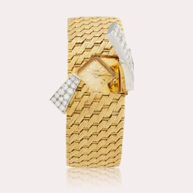 View full screen - View 1 of Lot 234. A yellow gold and diamond-set bracelet watch with concealed dial, Circa 1965 .