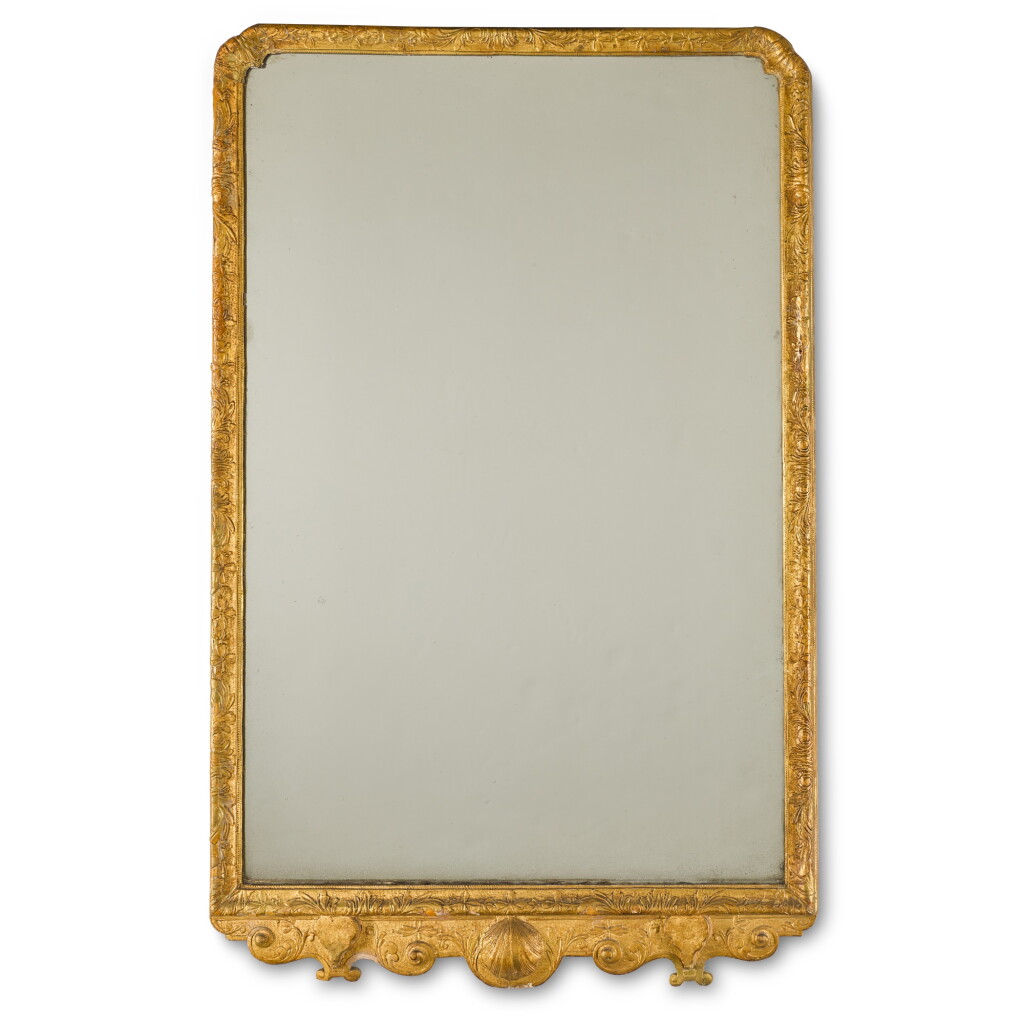 View full screen - View 1 of Lot 116. A George I giltwood and gilt gesso wall mirror, early 18th century.
