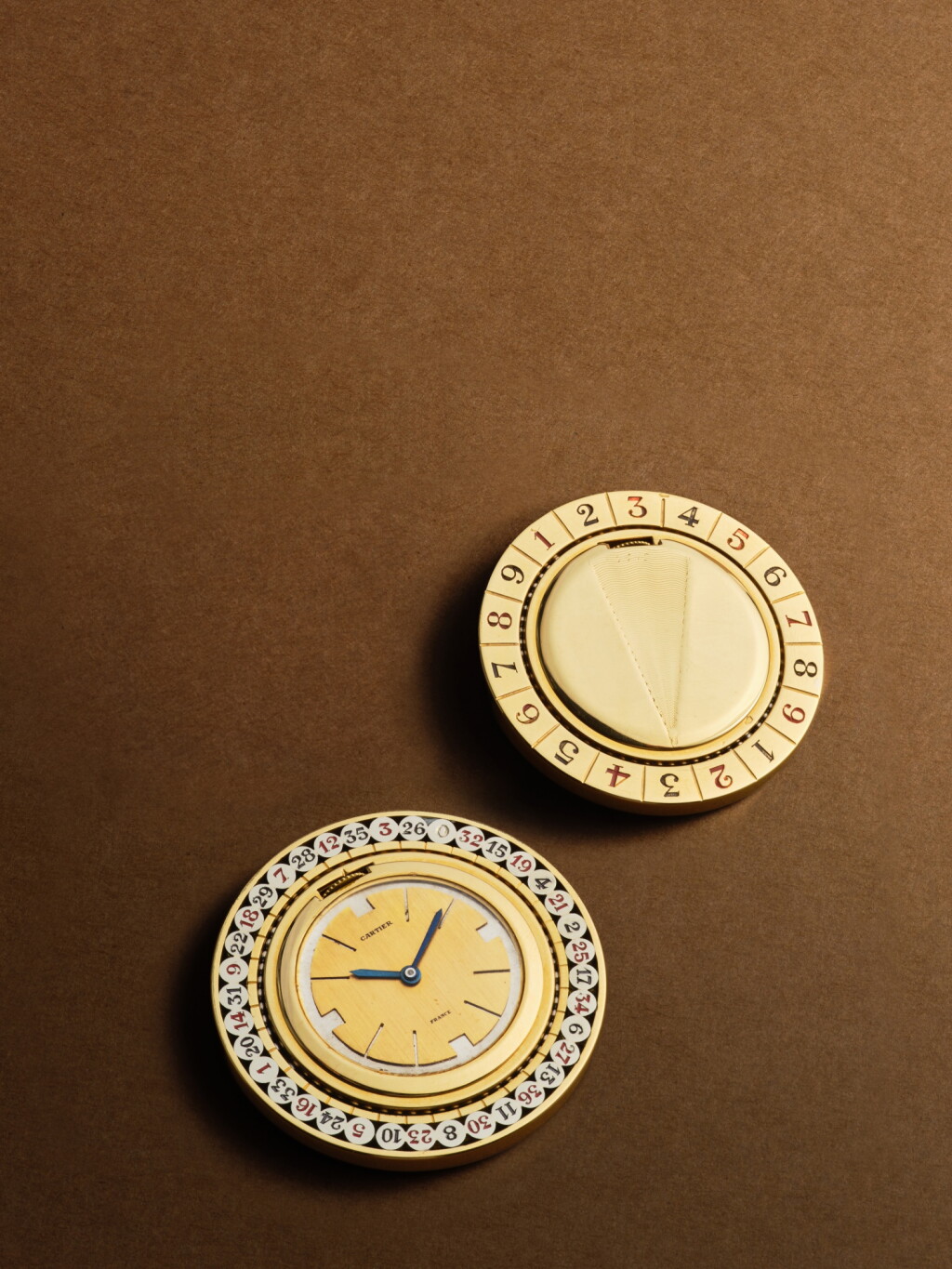 View full screen - View 1 of Lot 2253. New York retailed | A yellow gold watch in the form of a double-sided roulette wheel, Circa 1938 .