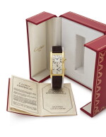 TANK CINTRÉE YELLOW GOLD RECTANGULAR WRISTWATCH WITH DUAL TIME-ZONE (OROLOGIO DA POLSO IN ORO GIALLO CON DOPPIO FUSO ORARIO) CIRCA 1990 | CARTIER, PARIS
