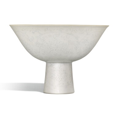 View full screen - View 1 of Lot 267. AN INCISED WHITE-GLAZED 'LOTUS' STEMBOWL, JIAQING MARK AND PERIOD | 清嘉慶 白釉暗花纏枝蓮紋高足盌 《大清嘉慶年製》款.