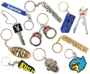 View full screen - View 1 of Lot 86. A GROUP OF 14 METAL SUPREME KEYCHAINS.