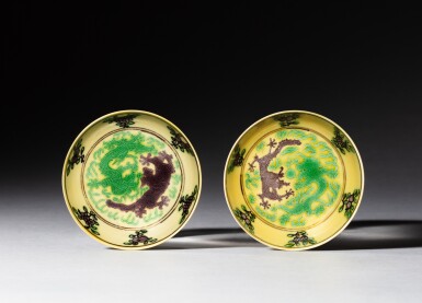 View full screen - View 1 of Lot 190. A pair of yellow-ground green and aubergine-enamelled 'dragon' dishes, Marks and period of Guangxu | 清光緒 黃地紫綠彩雙龍趕珠紋盤一對 《大清光緒年製》款 .
