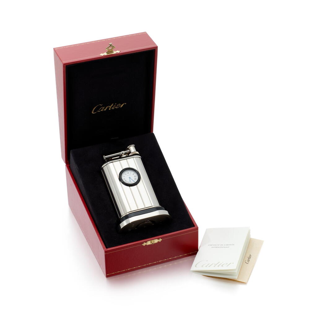 View full screen - View 1 of Lot 107. Stainless steel lighter with timepiece integrated, Circa 1990 (Accendino in acciaio inossidabile con orologio integrato, 1990).