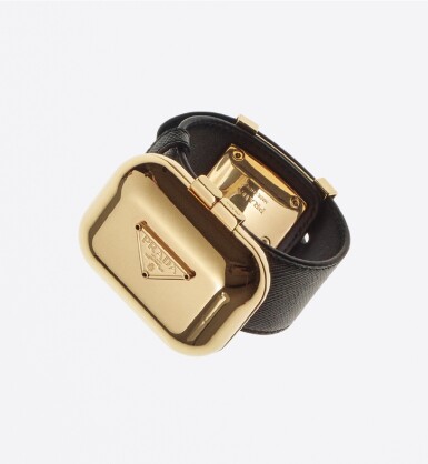 View full screen - View 1 of Lot 14. PRADA | SAFFIANO LEATHER AND METAL VANITY BRACELET.