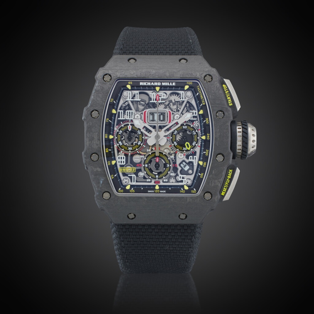 Voir en plein écran - Voir 1 du lot 23. Reference RM11-03 CA | A carbon TPT and titanium skeletonized automatic flyback chronograph wristwatch with date and month indicator, Owned and Worn by Tom Brady, Circa 2020.
