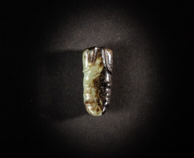 View full screen - View 1 of Lot 201. A celadon and black jade 'pupa' pendant, Neolithic period, probably Hongshan culture | 新石器時代 或紅山文化 青灰玉蠶蛹形飾.
