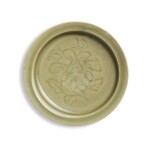 A carved Yaozhou celadon 'floral' dish, Northern Song dynasty | 北宋 耀州青釉劃花折沿盤